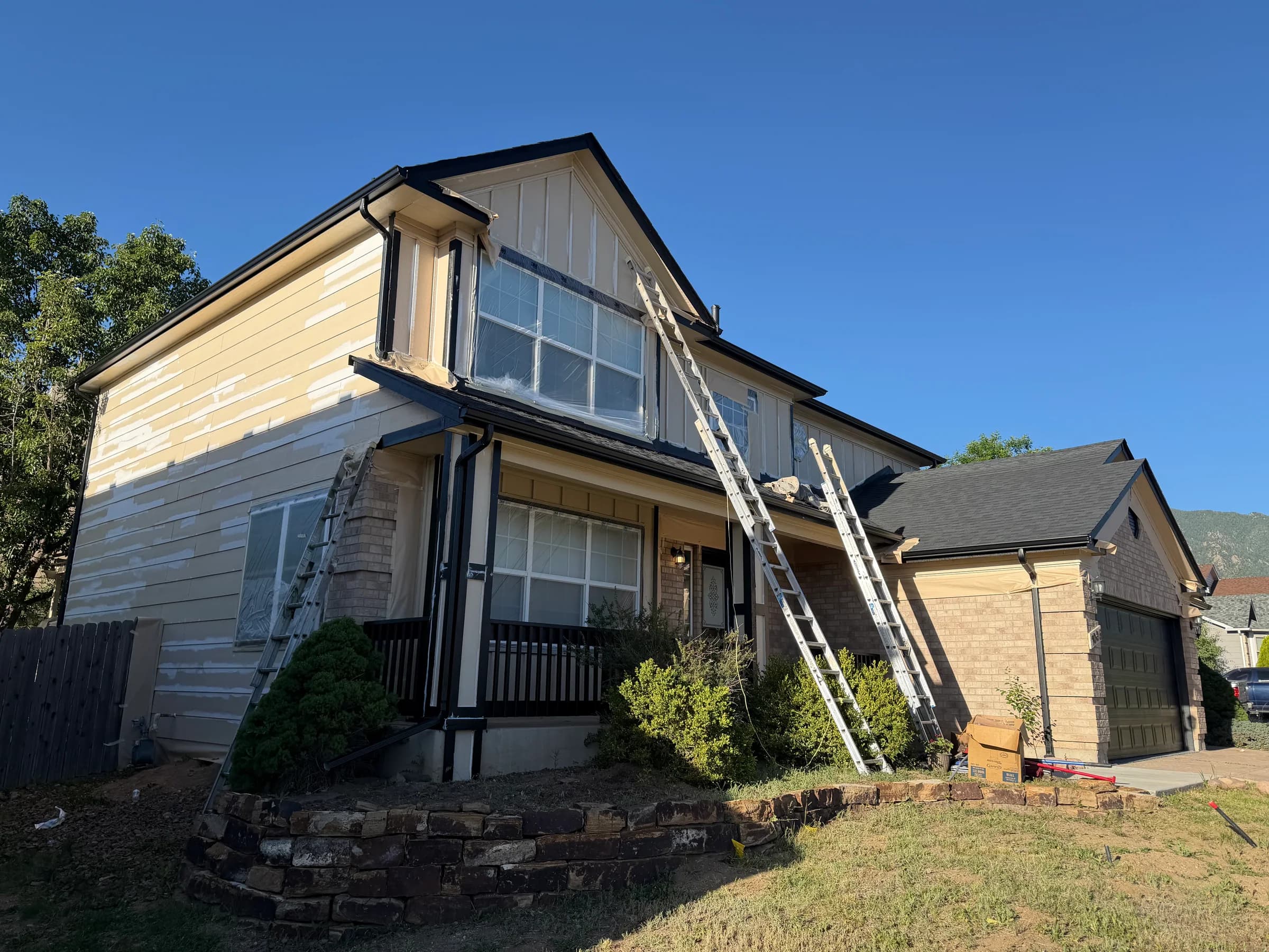 Residential exterior during surface preparation before painting